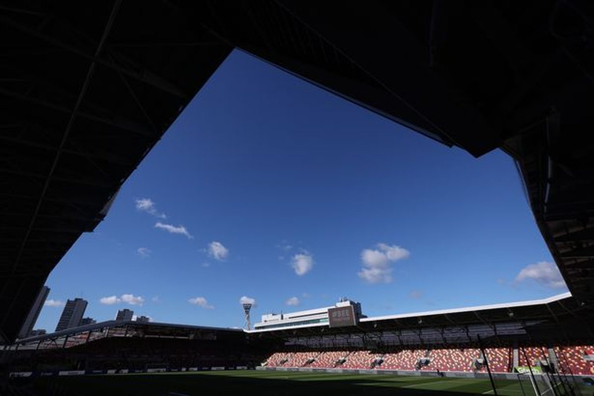 Rugby ball kicked from flat into Brentford pitch